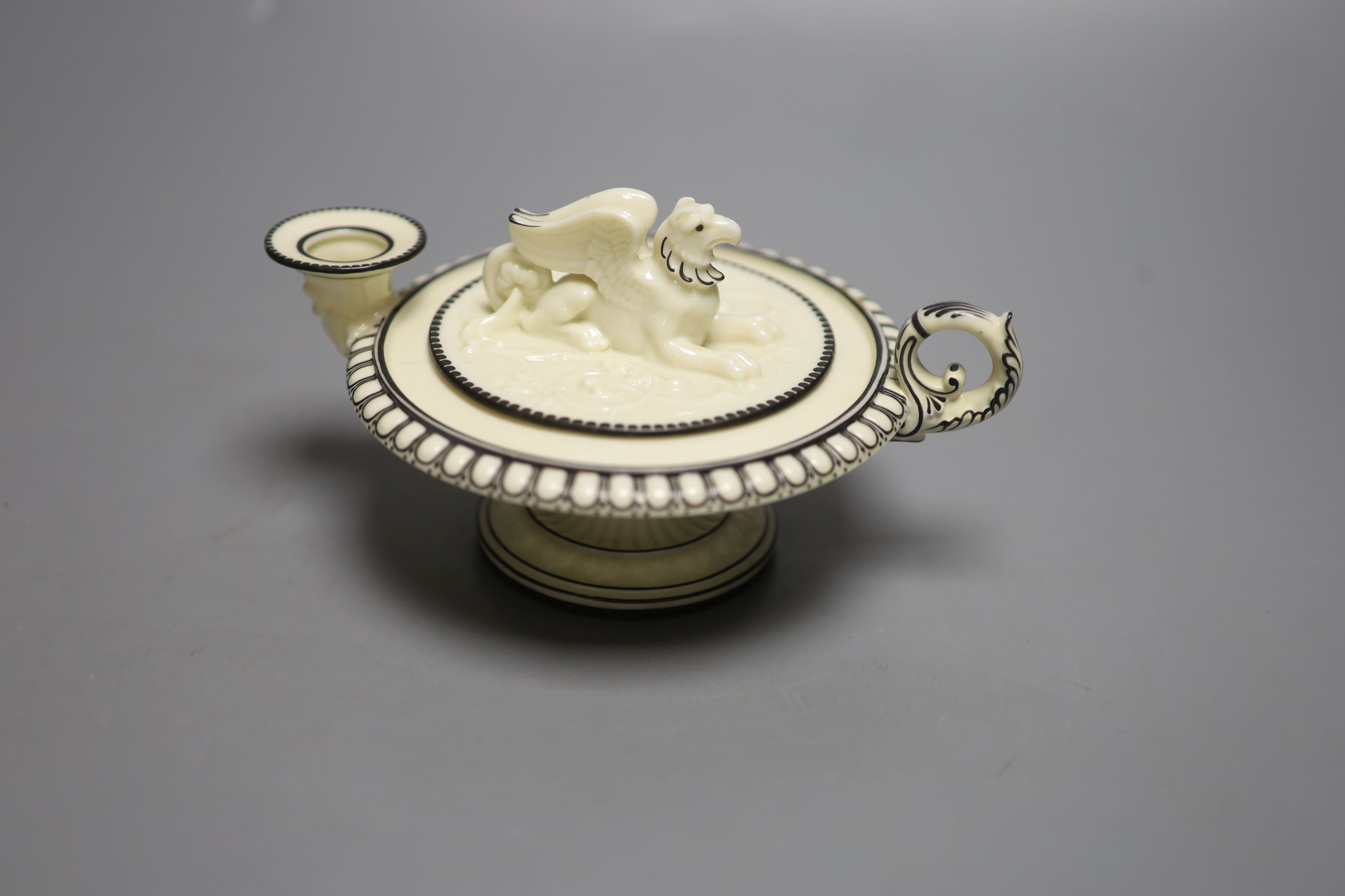 A rare Royal Worcester Kerr and Binns period inkwell, in the form of an oil lamp, with griffin finial